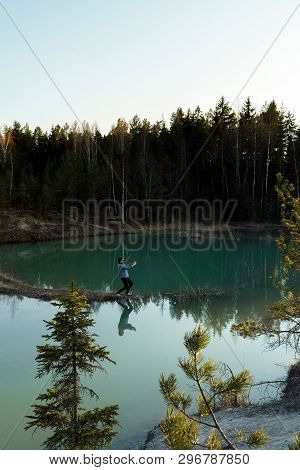 Young Man Take Travel Photos - Beautiful Turquoise Lake In Latvia - Meditirenian Style Colors In Bal