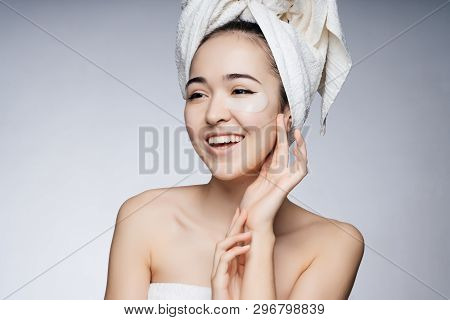 Beautiful Asian Girl With A Towel On Her Head, Patch Under The Eyes