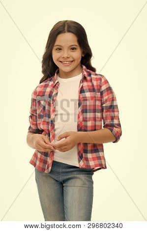 Carefree And Casual. Girl Cute Checkered Shirt And Denim Pants Looks Happy Cheerful. Child Girl Happ