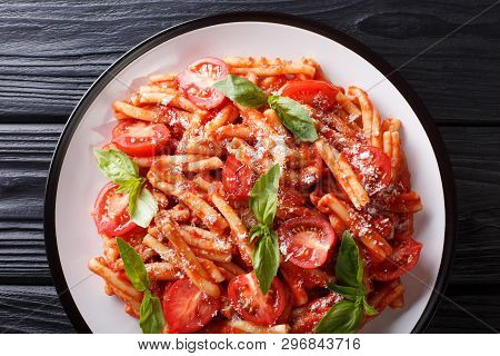 Vegetarian Pasta Casarecce With Tomato Sauce, Parmesan Cheese And Basil Closeup On A Plate. Horizont