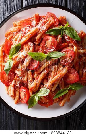 Italian Cuisine, Classic Pasta Recipe With Tomato Sauce, Parmesan Cheese And Basil Close-up On A Pla
