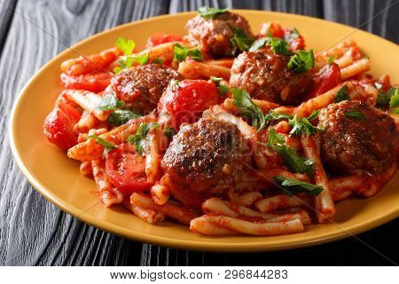 Pasta Casarecce Recipe With Meat Balls, Herbs And Cheese In Tomato Sauce Closeup On A Plate. Horizon