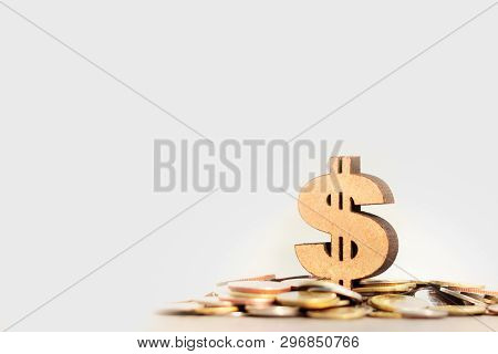 Dollar Symbol And Stack Of Coins In Concept Of Savings And Money Growing Or Energy Save. Business In