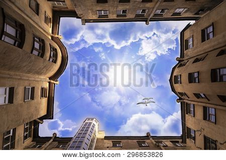 Old Town House. Birds Fly Over The House. Bottom View. View Of The Sunny Sky. Well, Architektura Old