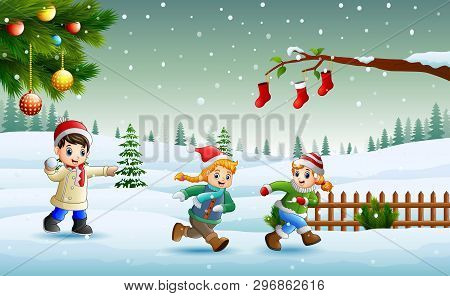 Happy Kids Playing And Running On The Snow In Christmas Day