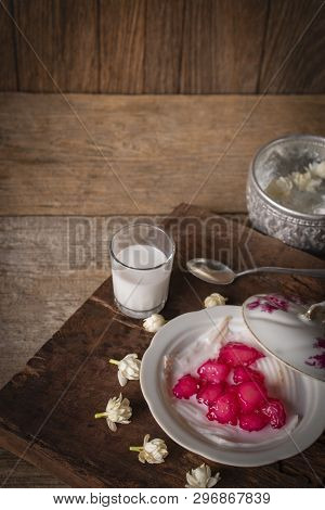 Thapthim Krop, Mock Pomegranate Seeds In Coconut And Syrup In The White Bowl On The Wood Table There
