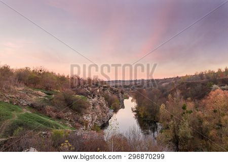 Calm River Flowing In Canyon With Overhanging Cliffs On Bank Among Forest At Late Autumn, Top View. 