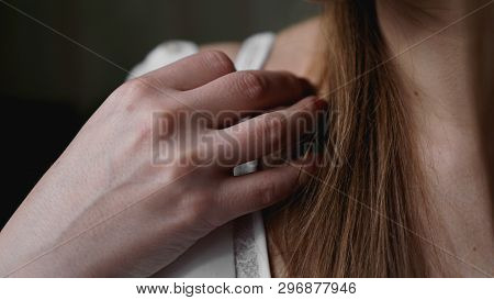 Hands Of Woman Undressing White Bra. Hands Of Woman Undressing Brassiere. Close-up Nude Photo