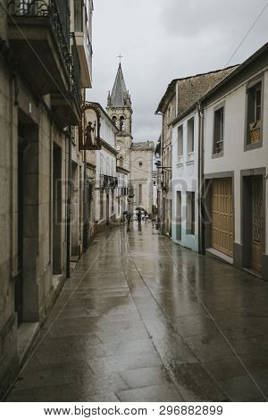 Sarria, Spain - April 6th, 2019: Perspective Of A Popular Street In Sarria Village Center, In A Rain