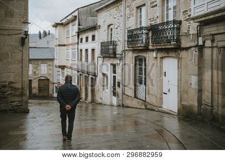 Sarria, Spain - April 6th, 2019: Perspective Of A Popular Street In Sarria Village Center, In A Rain