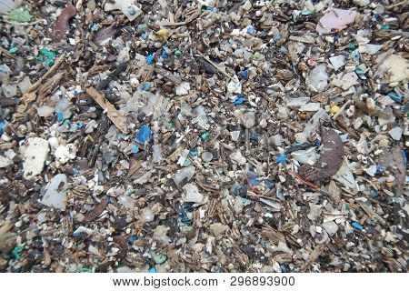 Micro Plastics Marine Debris On The Sand Beach.