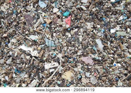Micro Plastics Marine Debris On The Sand Beach.