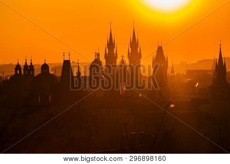 Hazy Morning Cityscape, Orange And Yellow Sunrise In Prague, Capital Of The Czech Republic, Sun Shin