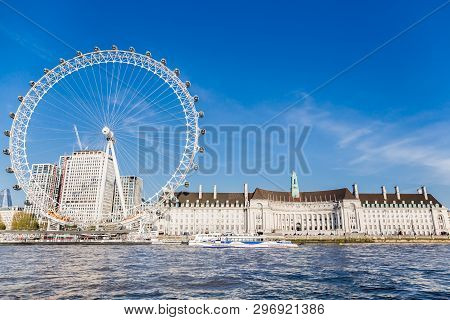 England London - April 20, 2019: London Eye Near County Hall In Summer View From Thame River Boat Cr