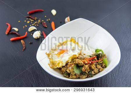 Spicy Thai Basil With Crispy Chicken And Egg (pad Krapow Gai) On Table . It Is A Very Delicious Thai