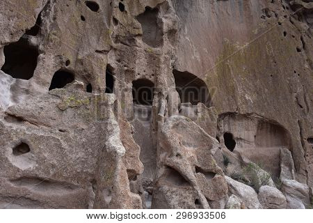 Large Sandstone Cliff Dwellings And Caverns Cut Out Of The Cliffs.
