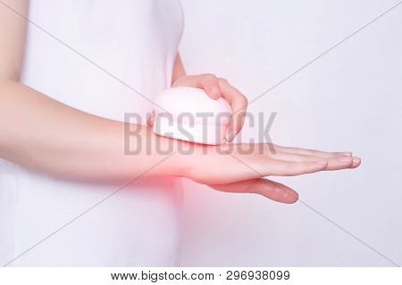 Girl Treats A Sore Wrist Joint With The Help Of Physiotherapy And Magnet Laser Treatment, White Back