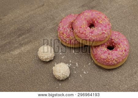Sweet Cream Cake On A Gray Background And Round Rafaelo Sweets