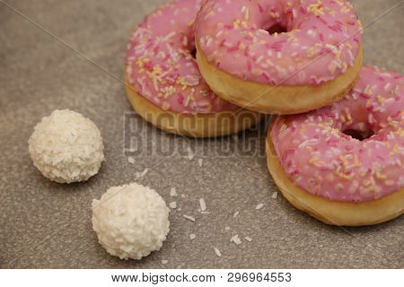 Sweet Cream Cake On A Gray Background And Round Rafaelo Sweets