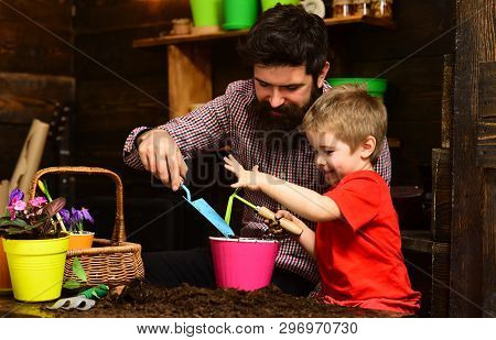 Father And Son. Family Day. Greenhouse. Bearded Man And Little Boy Child Love Nature. Happy Gardener