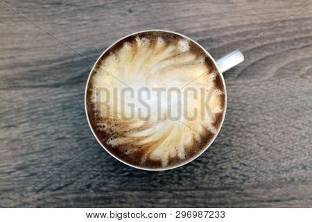 Cup Of Coffee With Milk. Stylishly Swirled.