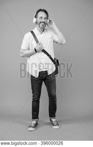 Cool Choice For Audiophile. Cool Man Listen To Music On Foot. Happy Adult Wear Headphones While Trav