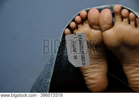 Not Focus And Noise Image, Concept Imitation Morgue, Coronavirus Victim Killed By 2019-ncov, Legs Of