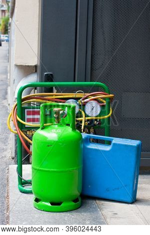 Green Butane Gas Cylinder And Blue Tool Case