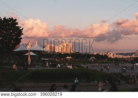 Seoul,south Korea-september 2020: People Enjoying The Sunset At Ttukseom Han River Park With Cotton 