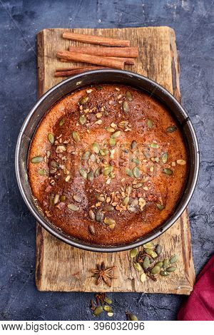 Pumpkin Pie With Lemon Zest, Pumpkin Seeds, Cinnamon, Fragrant And On A Dark Background. Healthyfood