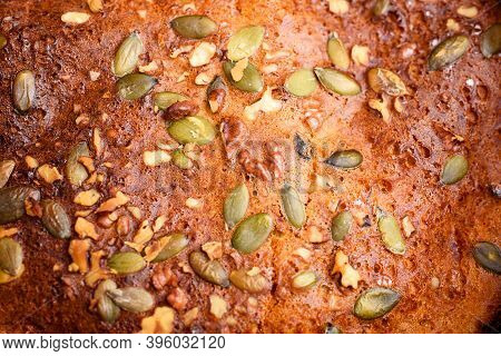 Pumpkin Pie With Lemon Zest, Pumpkin Seeds, Cinnamon, Fragrant And On A Dark Background. Healthyfood
