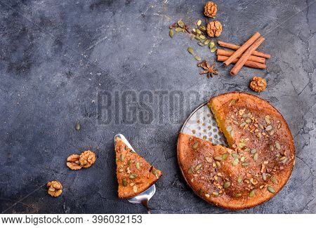 Pumpkin Pie With Lemon Zest, Pumpkin Seeds, Cinnamon, Fragrant And On A Dark Background. Healthyfood