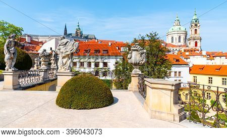 Prague Castle And St Nicholas Church In Lesser Town Of Prague. Sunny Spring Day View From Vrtba Gard