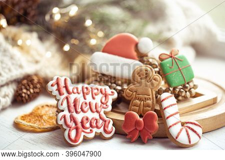 Christmas Composition With Glazed Handmade Gingerbread Cookies With Happy New Year Wishes. Home Wint