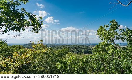 View From The Top Of The Rock Wall Of The Stenzelberg Over The Wooded Area Far To Cologne.