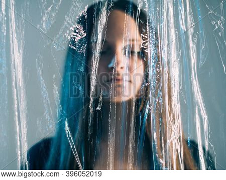 Plastic Pollution. Waste Recycling. Ecology Problem. Save Planet. Portrait Of Blur Cold Emotionless 