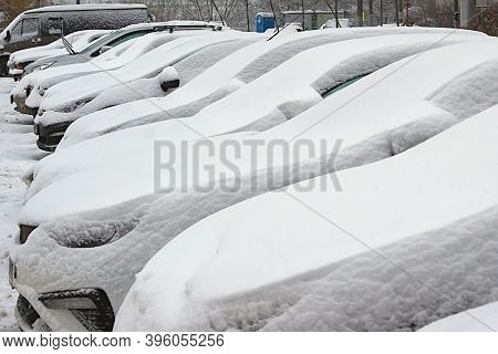 Cars In The Parking Lot Are Covered With Fres