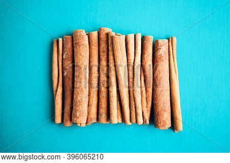 Cinnamon Sticks On The Turquois, Blue Background