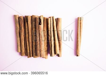 Cinnamon Sticks On The Pink Background With Copy Space For Your Text