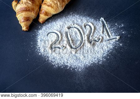 2021 New Year Numbers In The Background Two Croissants On