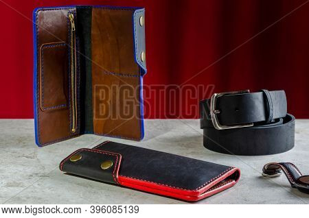 Mens Wallet Longer Made Of Genuine Black Leather Handmade With A Red And Blue End On A Red Backgroun