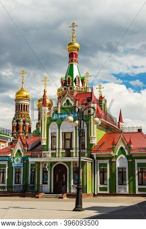 Yoshkar-ola, Mari El, Russia 30 July 2020: Arkhangelskaya Sloboda Quay Bruges Beautiful Green House.