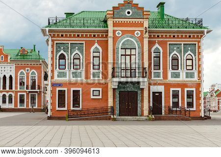 Yoshkar-ola, Mari El, Russia 30 July 2020: Arkhangelskaya Sloboda Quay Bruges Beautiful Brick House 