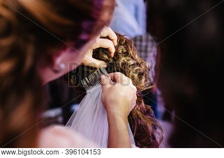 Mother Hands Holding Ornaments And Helping Dressing Veil Bride. Bridesmaid Preparing Bride, Helping 