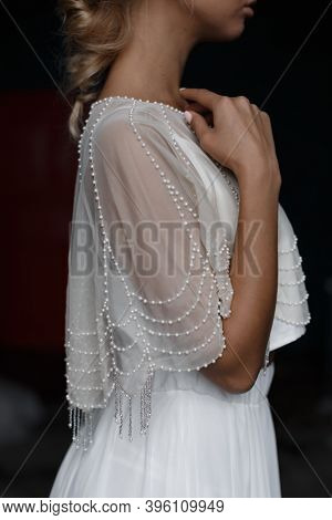 Close Up Photo Of Pretty Blonde Bride In White Wedding Dress. Beautiful Marriage Dress With Beads. S