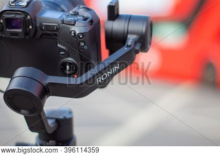 Ronin Stabilizer And Camera Overlooking A Blurry Street