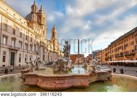 Piazza Navona, a historic public open space and significant example of Baroque Roman architecture in Rome with Fontana del Moro (Moor Fountain) in foreground and Fontana dei Quattro Fiumi in backgroun