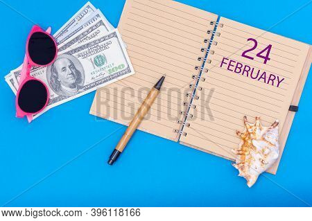 February 24th. 24th Day Of February. Travel Plan Flat Design With Notepad Written Date, Pen, Glasses