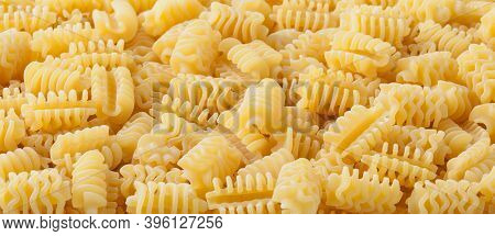 Close Up Of Uncooked Radiatori Pasta Background