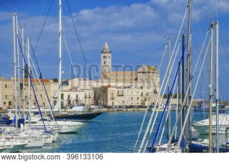 Trani, Italy - April 29, 2019: Cathedral San Nicola Pellegrino In Trani, Italy With Harbor View.